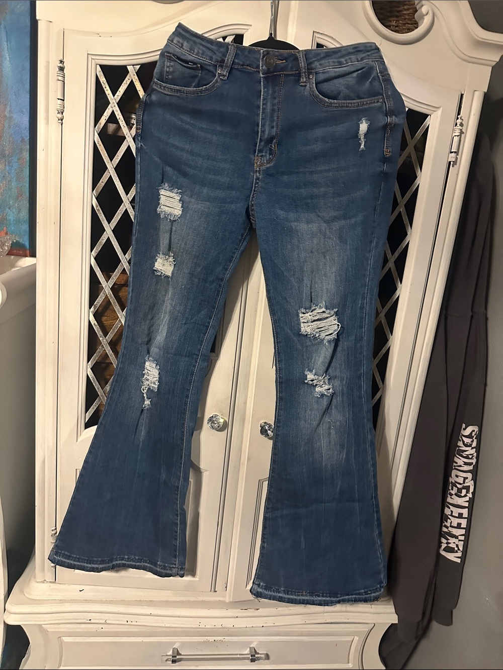 Distressed medium dark bell bottom jeans
